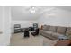 Bonus room offers flexible space, with gray sofa, modern television console and comfortable seating at 578 Island Walk East, Mount Pleasant, SC 29464