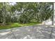 Large driveway leading to a home with a lush, tree-filled backyard at 578 Island Walk East, Mount Pleasant, SC 29464