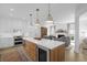 A full kitchen with stainless steel appliances, custom cabinetry, and modern pendant lighting at 578 Island Walk East, Mount Pleasant, SC 29464