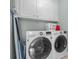 Well-equipped laundry room featuring a washer, dryer, and ample storage space at 578 Island Walk East, Mount Pleasant, SC 29464