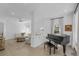 Inviting living room boasts a classic piano, natural light, and neutral decor at 578 Island Walk East, Mount Pleasant, SC 29464