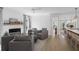 The living room features a fireplace, modern light fixtures and hardwood floors at 578 Island Walk East, Mount Pleasant, SC 29464