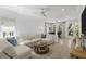 Spacious living room featuring a comfortable sectional, stylish coffee table, and bright lighting at 578 Island Walk East, Mount Pleasant, SC 29464