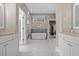 Luxurious main bathroom features dual vanities, a soaking tub, and a separate glass shower at 578 Island Walk East, Mount Pleasant, SC 29464