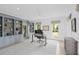 Bright office featuring custom built-ins, modern lighting, and large windows offering great natural light at 578 Island Walk East, Mount Pleasant, SC 29464