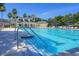Community swimming pool with lounge chairs and clubhouse in the background at 578 Island Walk East, Mount Pleasant, SC 29464