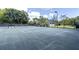 Full tennis court for residential community with benches and manicured landscaping at 578 Island Walk East, Mount Pleasant, SC 29464