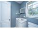 Bathroom features a sink, a window, and a toilet at 610 Old Golf Rd, Summerville, SC 29483