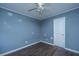 Bedroom with hardwood floors, a door and ceiling fan at 610 Old Golf Rd, Summerville, SC 29483