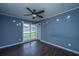 Spacious bedroom features a ceiling fan, a window with a view, and laminate floors at 610 Old Golf Rd, Summerville, SC 29483