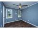 Bedroom with hardwood floors and two windows at 610 Old Golf Rd, Summerville, SC 29483