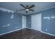 Bedroom featuring laminate floors, ceiling fan, window, and closet at 610 Old Golf Rd, Summerville, SC 29483