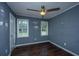 Bedroom with hardwood floors and two windows at 610 Old Golf Rd, Summerville, SC 29483