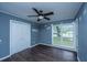 Standard bedroom featuring laminate floors, window, and closet at 610 Old Golf Rd, Summerville, SC 29483