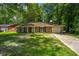 Charming brick home with a well-manicured front yard and mature trees at 610 Old Golf Rd, Summerville, SC 29483