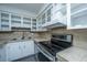 Well-lit kitchen featuring stainless steel appliances and ample cabinet space at 610 Old Golf Rd, Summerville, SC 29483