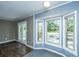 Sunroom boasts of an adjacent door, and bay window, with natural light, and neutral-toned walls at 610 Old Golf Rd, Summerville, SC 29483