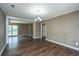 Spacious living room featuring hardwood floors and a chandelier at 610 Old Golf Rd, Summerville, SC 29483