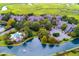 Breathtaking aerial view of townhomes surrounding a serene pond, pool, and lush greenery at 638 Harbor Creek Pl # 19, Charleston, SC 29412