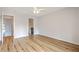 Spacious bedroom with ensuite bath featuring wood floors and ceiling fan at 638 Harbor Creek Pl # 19, Charleston, SC 29412