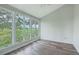 Bright bedroom with large windows that provide views of the trees and landscape at 638 Harbor Creek Pl # 19, Charleston, SC 29412