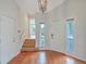 Inviting foyer with wooden staircase and ample natural light at 638 Harbor Creek Pl # 19, Charleston, SC 29412