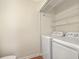 Convenient laundry area with full-size white washer and dryer at 638 Harbor Creek Pl # 19, Charleston, SC 29412