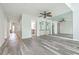 Living room showcasing an open floor plan, light gray floors, and mirrored wall at 638 Harbor Creek Pl # 19, Charleston, SC 29412