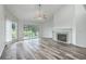Bright living room with a vaulted ceiling, fireplace, and scenic outdoor views at 638 Harbor Creek Pl # 19, Charleston, SC 29412