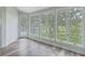 Bright sun room with many windows bringing the beautiful outdoors inside at 638 Harbor Creek Pl # 19, Charleston, SC 29412