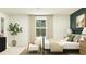 Bright bedroom featuring a comfortable bed, soft lighting, neutral tones, and chic decor at 639 Culpepper St, Summerville, SC 29486