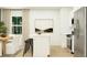 Modern kitchen with an island, stainless steel appliances, breakfast bar, and adjacent dining space at 639 Culpepper St, Summerville, SC 29486