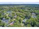 An aerial view features a residential neighborhood surrounded by lush greenery and serene waterfront scenery at 750 Navigators Run, Mount Pleasant, SC 29464