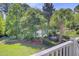 Scenic view of a backyard with lush greenery, a pond with a fountain, and well-maintained landscaping at 750 Navigators Run, Mount Pleasant, SC 29464