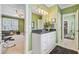 Bright bathroom with green walls, white vanity, and a doorway to a bonus room at 750 Navigators Run, Mount Pleasant, SC 29464