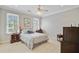 Bright bedroom features two large windows, neutral walls, and a comfortable bed with decorative pillows at 750 Navigators Run, Mount Pleasant, SC 29464