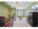 Bright bonus room features a ceiling fan, large windows, and exercise equipment at 750 Navigators Run, Mount Pleasant, SC 29464