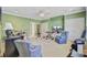 Versatile bonus room with entertainment center, accent furniture, and neutral carpeting at 750 Navigators Run, Mount Pleasant, SC 29464