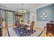 Formal dining room featuring blue walls, and a traditional chandelier at 750 Navigators Run, Mount Pleasant, SC 29464