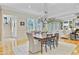 Bright dining room with hardwood floors and an elegant chandelier at 750 Navigators Run, Mount Pleasant, SC 29464