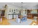 Charming dining area with a wooden table, unique chandelier, and plenty of natural light at 750 Navigators Run, Mount Pleasant, SC 29464