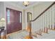 Foyer with wood door, staircase, and hardwood floors at 750 Navigators Run, Mount Pleasant, SC 29464