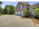 Brick home with a spacious three car garage, ample parking and beautifully landscaped yard at 750 Navigators Run, Mount Pleasant, SC 29464