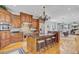 Open kitchen with stainless steel appliances, hardwood floors, and breakfast bar seating at 750 Navigators Run, Mount Pleasant, SC 29464