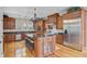 Gourmet kitchen with stainless steel appliances, an island with seating, and hardwood floors at 750 Navigators Run, Mount Pleasant, SC 29464