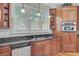 Elegant kitchen with dark granite countertops, stainless steel appliances, and bright windows at 750 Navigators Run, Mount Pleasant, SC 29464