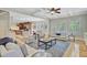 Spacious living area with high ceilings, ceiling fan, hardwood floors, and ample seating at 750 Navigators Run, Mount Pleasant, SC 29464