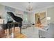 Living room featuring a piano, natural light, and elegant seating at 750 Navigators Run, Mount Pleasant, SC 29464