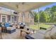 Inviting screened porch featuring comfortable wicker seating for relaxing and outdoor living at 750 Navigators Run, Mount Pleasant, SC 29464