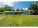 Expansive backyard featuring a covered patio and a home exterior with a charming pergola at 762 Swanson Ave Ave, Charleston, SC 29412